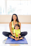 Mother and daughter exercising together.