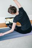 Woman stretching on map.