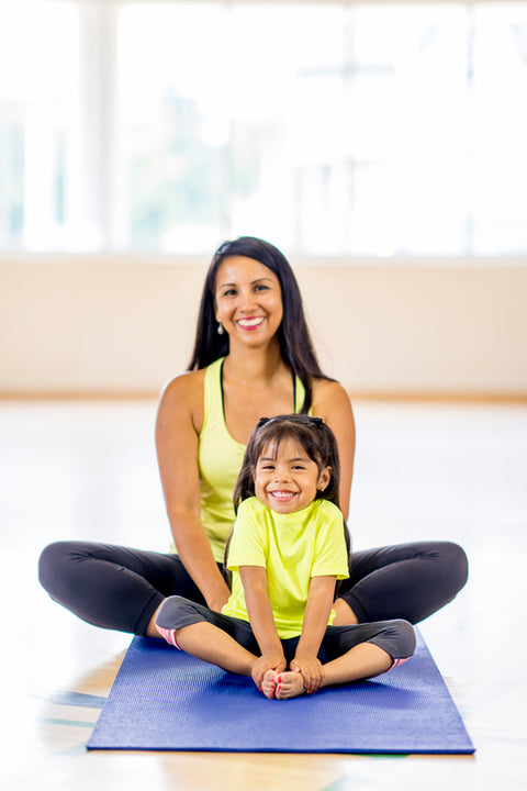 Mother and daughter exercising together.
