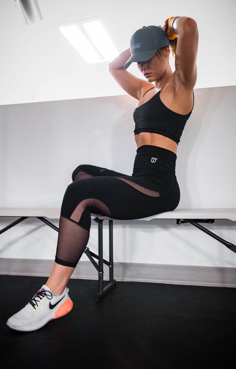 30 day workout abs course featuring woman sitting fixing hair. 
