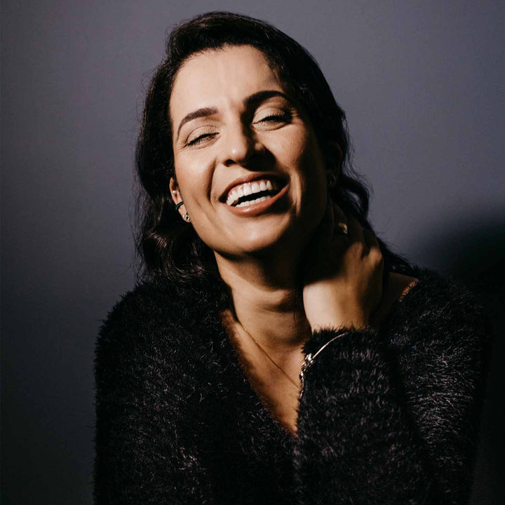 Will jaw exercises work featuring woman smiling.